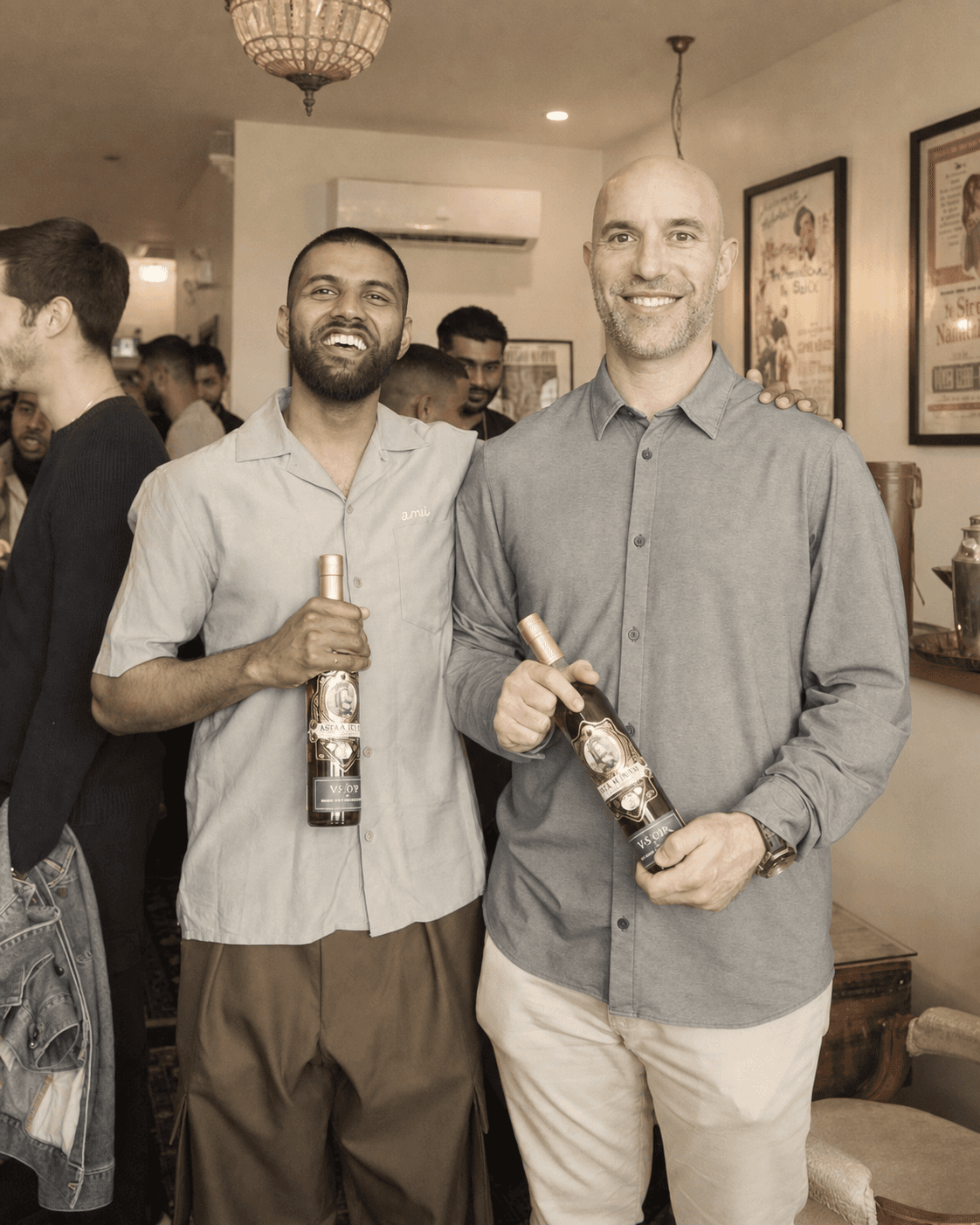 Marc and David holding bottles from the Elora collaboration